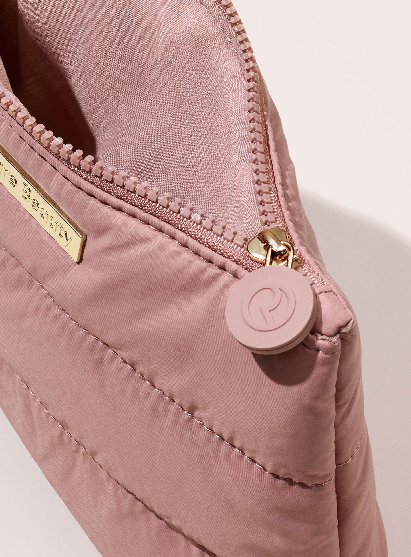 pdp-puffy-makeup-bag-mauve-top-zip.jpg